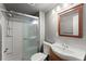 Bathroom features tiled walk-in shower, tiled floor, and a modern vanity at 1718 Maryland Ave, Ormond Beach, FL 32174