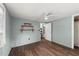 Simple bedroom with hardwood floors, storage shelving and great natural light at 1718 Maryland Ave, Ormond Beach, FL 32174
