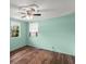 Bright bedroom with a ceiling fan, wood flooring, and natural light at 1718 Maryland Ave, Ormond Beach, FL 32174