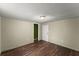 Cozy bedroom with hardwood floors and neutral walls plus attached closet at 1718 Maryland Ave, Ormond Beach, FL 32174