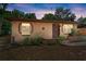 Quaint single story home with a traditional front door and landscape features at 1718 Maryland Ave, Ormond Beach, FL 32174