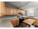 Bright kitchen with a double sink, stainless steel appliances and wood cabinets at 1718 Maryland Ave, Ormond Beach, FL 32174