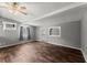 Bright living room featuring hardwood floors, a ceiling fan, and lots of natural light at 1718 Maryland Ave, Ormond Beach, FL 32174