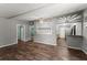 Spacious living room with hardwood floors, decorative ceiling fan, and views to adjacent rooms at 1718 Maryland Ave, Ormond Beach, FL 32174