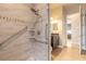 Walk-in shower featuring safety rails, a handheld shower head, and decorative tile at 1734 Covendale Ln, Port Orange, FL 32128