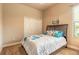 Comfortable bedroom with a full bed, plush bedding, a closet, and a window at 1734 Covendale Ln, Port Orange, FL 32128