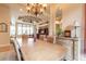 Open concept dining room with a wooden table, seating for six, and views of the living room at 1734 Covendale Ln, Port Orange, FL 32128