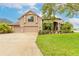 Beautiful home with a three car garage, well-maintained landscaping, and a manicured lawn at 1734 Covendale Ln, Port Orange, FL 32128