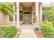 Charming front porch with columns, double doors, and lush landscaping at 1734 Covendale Ln, Port Orange, FL 32128