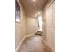 Hallway with neutral paint, carpet, and white doors, leading to other rooms at 1734 Covendale Ln, Port Orange, FL 32128