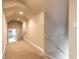 Bright hallway featuring neutral walls, trim, recessed lighting, carpet flooring, and a view into the adjacent room at 1734 Covendale Ln, Port Orange, FL 32128
