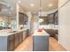 Spacious kitchen featuring an island, gray cabinets, and stainless steel appliances at 1734 Covendale Ln, Port Orange, FL 32128