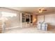 Spacious living area with built-in shelving, comfortable seating, and bright window at 1734 Covendale Ln, Port Orange, FL 32128