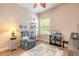 Cozy living room with a blue recliner, an aquarium, and a ceiling fan at 1734 Covendale Ln, Port Orange, FL 32128