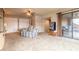 Large living room with neutral carpet, striped couch, built-ins, slider to the patio, and storage at 1734 Covendale Ln, Port Orange, FL 32128