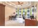This home office has space for two desks, tray ceilings, and large windows for natural light at 1734 Covendale Ln, Port Orange, FL 32128