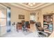 Office space with an arched doorway, ceiling fan, and view of the living room at 1734 Covendale Ln, Port Orange, FL 32128