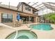 Outdoor living space with a screened-in pool, patio, and dining area at 1734 Covendale Ln, Port Orange, FL 32128
