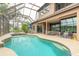 Relaxing pool area with spa and patio overlooking a serene lake, offering a tranquil outdoor experience at 1734 Covendale Ln, Port Orange, FL 32128
