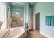 This bathroom has a glass block window and shower, and a separate room for the toilet at 1734 Covendale Ln, Port Orange, FL 32128