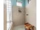 An elegant tiled shower has a shower head, and a separate seat at 1734 Covendale Ln, Port Orange, FL 32128