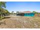 Backyard featuring a pool and screened patio offers both leisure and comfort at 1845 Willow Oak Dr, Edgewater, FL 32141