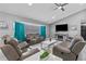 An open living room featuring a ceiling fan, modern decor, and a large window with dark blinds at 1845 Willow Oak Dr, Edgewater, FL 32141