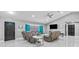 A grey living room featuring recessed lighting, modern furniture, and large windows with blinds at 1845 Willow Oak Dr, Edgewater, FL 32141