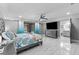 Spacious bedroom suite featuring a large bed and access to an en-suite bathroom at 1845 Willow Oak Dr, Edgewater, FL 32141