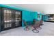 Covered outdoor patio features an outdoor dining area perfect for relaxing and entertaining at 1845 Willow Oak Dr, Edgewater, FL 32141
