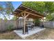 Stylish pergola offers an outdoor dining area with a barbecue grill at 1845 Willow Oak Dr, Edgewater, FL 32141
