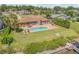 Private waterfront home with a backyard pool, patio and lush landscaping at 1905 S Riverside Dr, Edgewater, FL 32141