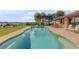 Backyard pool with dock access blends fun and relaxation for an enhanced waterfront living experience at 1905 S Riverside Dr, Edgewater, FL 32141