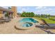 Gorgeous swimming pool and hot tub in backyard offer luxurious outdoor living at 1905 S Riverside Dr, Edgewater, FL 32141