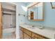 This traditional bathroom features a shower/tub, single sink, and a neutral countertop at 1905 S Riverside Dr, Edgewater, FL 32141