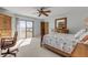 Bright bedroom features a sliding glass doors that lead to a patio at 1905 S Riverside Dr, Edgewater, FL 32141