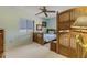 This cozy bedroom features unique bunk beds, a ceiling fan, and plenty of natural light from the window at 1905 S Riverside Dr, Edgewater, FL 32141