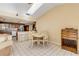 Dining area open to kitchen with breakfast bar and lots of lighting at 1905 S Riverside Dr, Edgewater, FL 32141