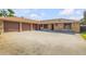 Spacious home with a three-car garage and large driveway at 1905 S Riverside Dr, Edgewater, FL 32141