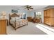 Serene main bedroom featuring a king bed, stylish furniture, and ample natural light at 1905 S Riverside Dr, Edgewater, FL 32141