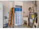 Utility shower with water heater, sink and ladder, ready for cleanups after outdoor activities at 1905 S Riverside Dr, Edgewater, FL 32141