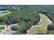 High angle aerial showing the properties next to the community golf course at 1999 Turnbull Lakes Dr, New Smyrna Beach, FL 32168