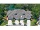 Aerial view of the community highlighting well-maintained landscaping, and garage parking at 1999 Turnbull Lakes Dr, New Smyrna Beach, FL 32168