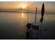 View of the sunset as it casts a golden glow on the beach at 1999 Turnbull Lakes Dr, New Smyrna Beach, FL 32168