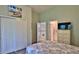 Bedroom with natural light, ensuite bathroom, and view of upstairs landing at 1999 Turnbull Lakes Dr, New Smyrna Beach, FL 32168