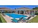 Relaxing community pool area with lounge chairs and shaded seating at 1999 Turnbull Lakes Dr, New Smyrna Beach, FL 32168