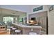 Eat-in kitchen features granite countertops, stainless steel appliances, and open layout at 1999 Turnbull Lakes Dr, New Smyrna Beach, FL 32168