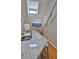 Modern kitchen with granite countertops and stairs nearby leading to the upper level at 1999 Turnbull Lakes Dr, New Smyrna Beach, FL 32168