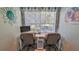 Bright office area with a work space, natural light and ocean-themed decor at 1999 Turnbull Lakes Dr, New Smyrna Beach, FL 32168