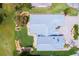 Aerial view featuring backyard landscaping, circular driveway, and home layout at 2005 Country Club Dr, Port Orange, FL 32128